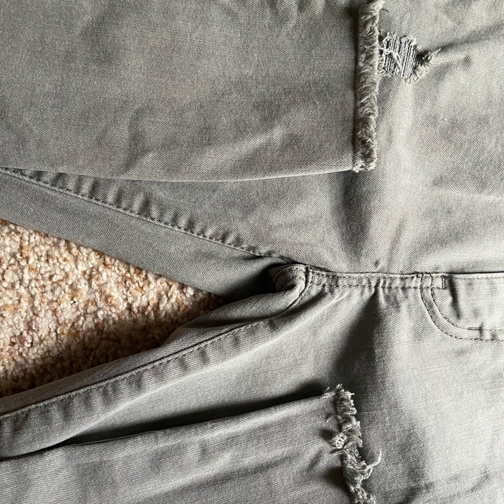 ripped navy green jeans